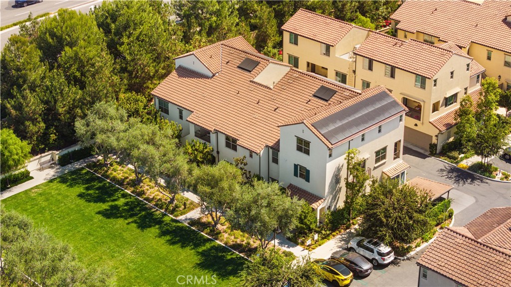 104 Coastal Garden Irvine, CA 92618 - Photo 35 of 43 a aerial view of a house with a yard and garden
