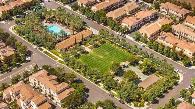 an aerial view of residential building with an ocean