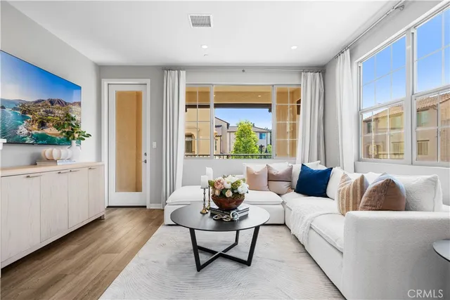 a living room with furniture and a large window