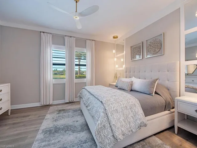 a spacious bedroom with a large bed and a window