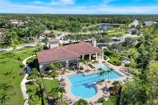 an aerial view of a house with garden space and street view