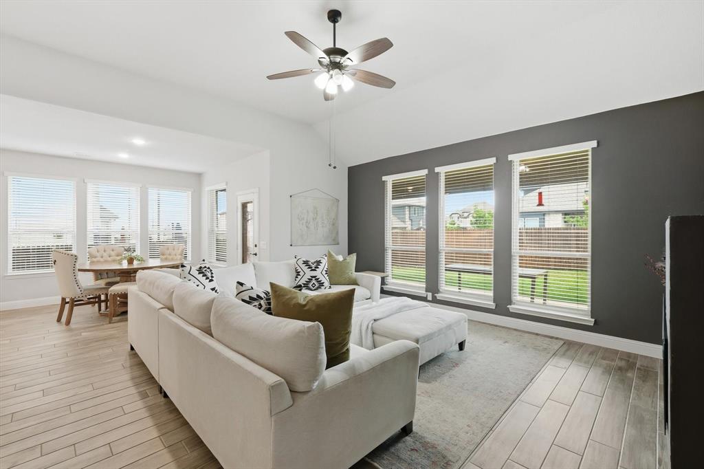 924 Timber Ridge Drive Justin, TX 76247 - Photo 17 of 32 Open-concept living space featuring wood-finish flooring, recessed lighting, and a ceiling fan