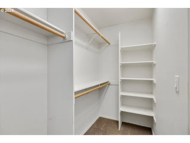 a view of an empty walk in closet