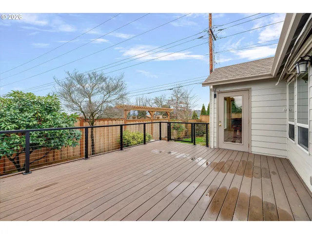 a view of balcony with wooden floor