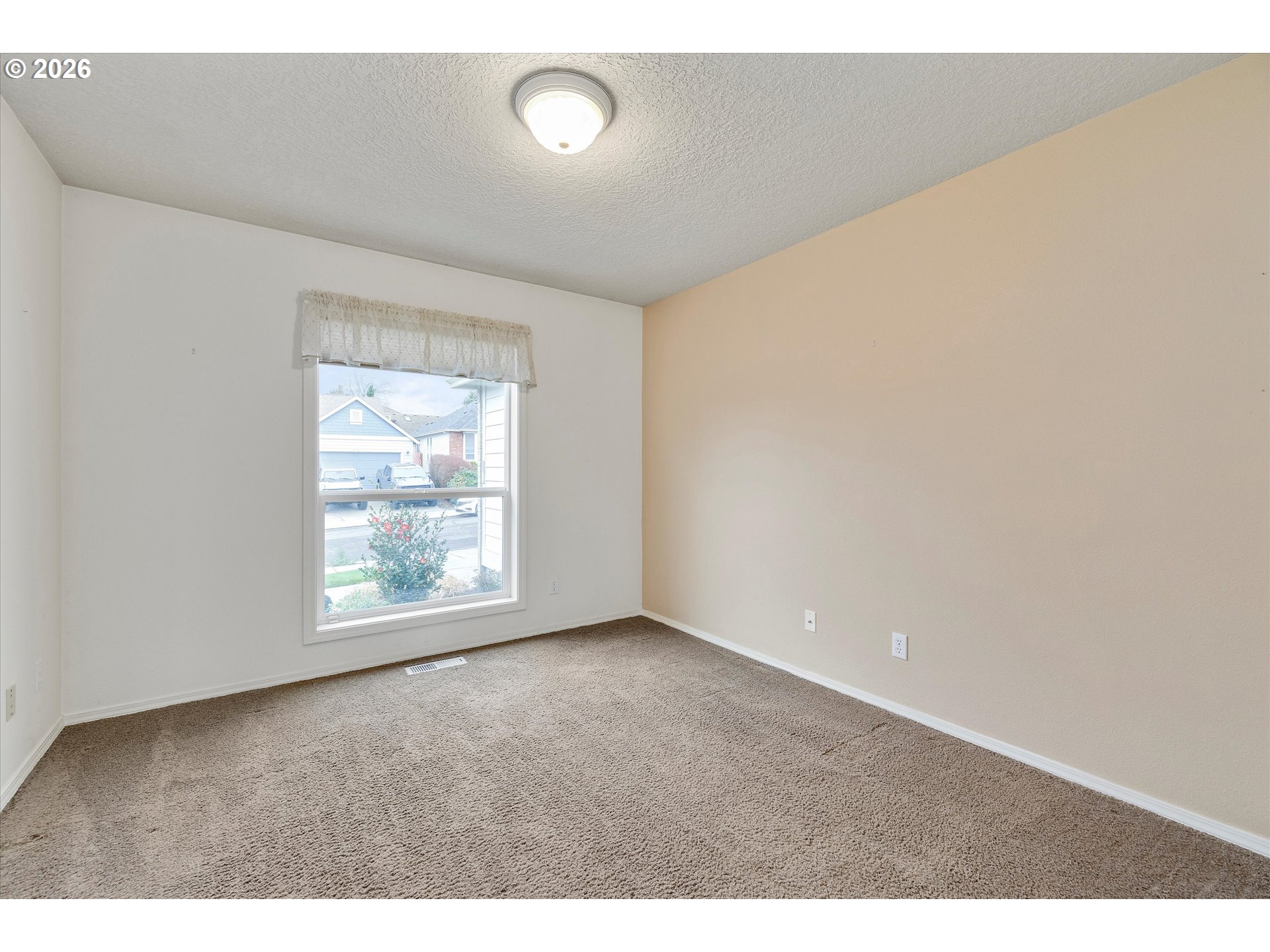 3519 Southwest 28th Terrace Gresham, OR 97080 - Photo 9 of 31 a view of an empty room with a window