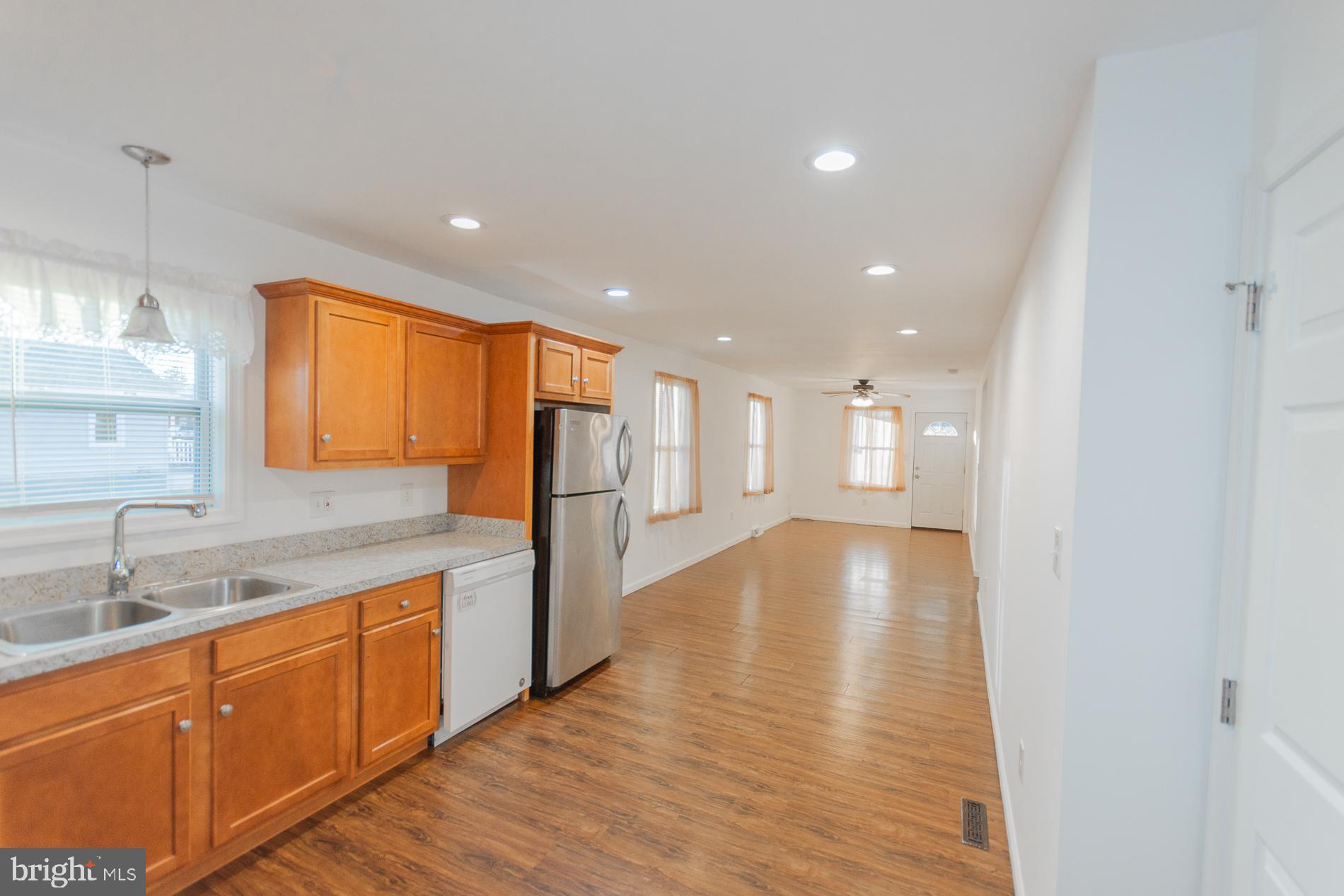 300 West 4th Avenue Ranson, WV 25438 - Photo 12 of 45 a view of a kitchen with a sink and wooden floor