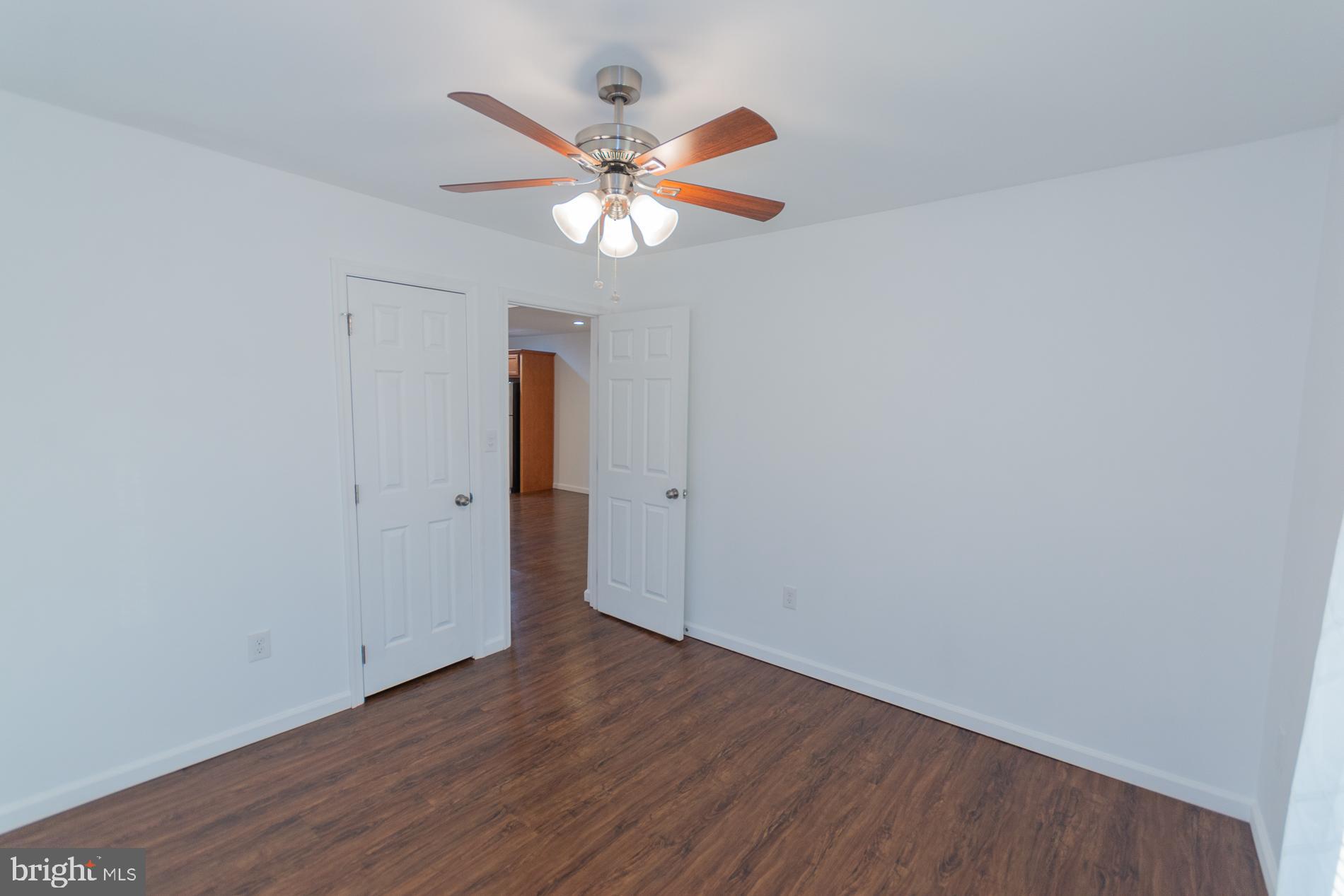300 West 4th Avenue Ranson, WV 25438 - Photo 18 of 45 wooden floor in an empty room with a window