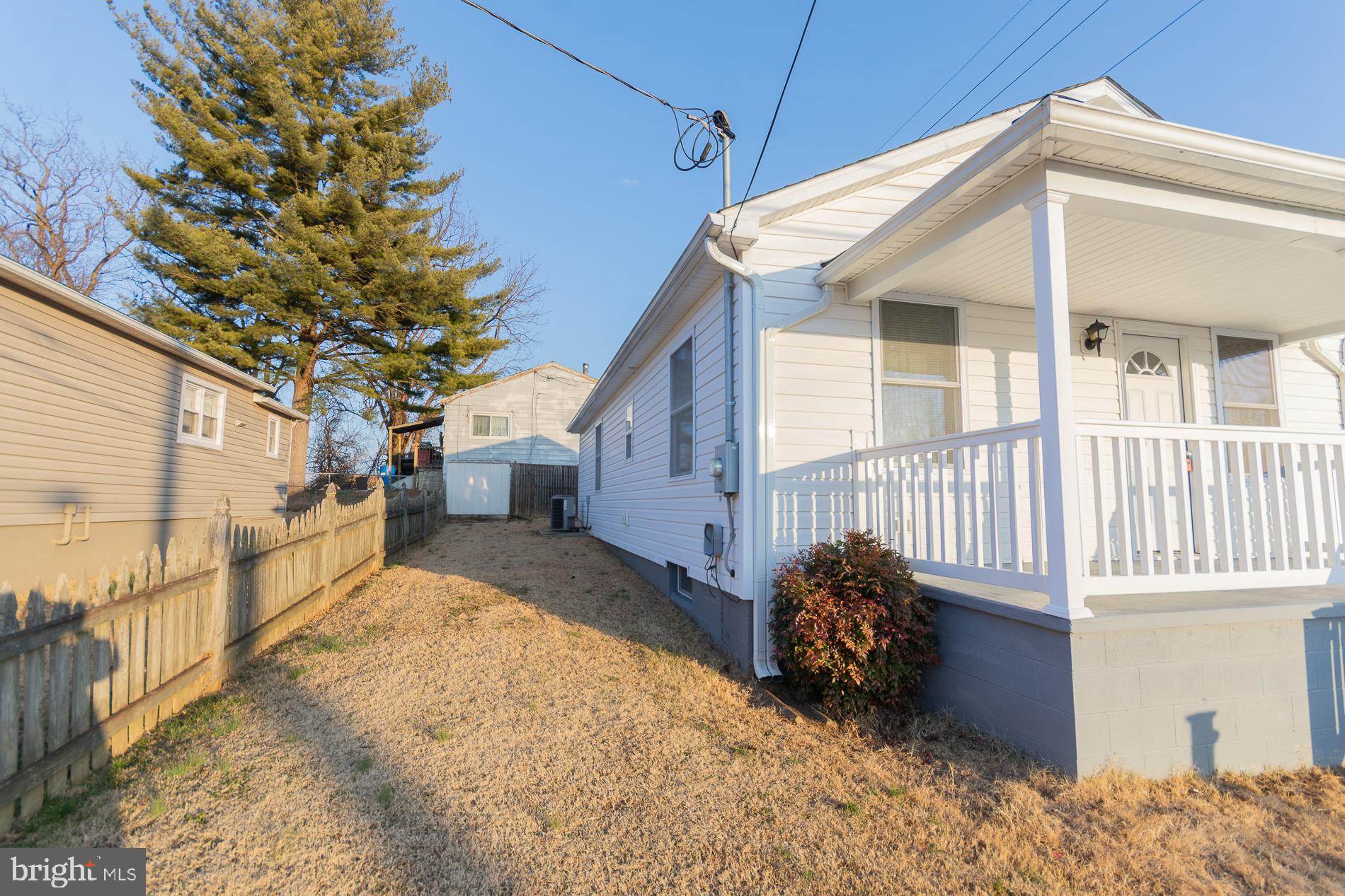 300 West 4th Avenue Ranson, WV 25438 - Photo 30 of 45 a view of a house with a bed and wooden fence