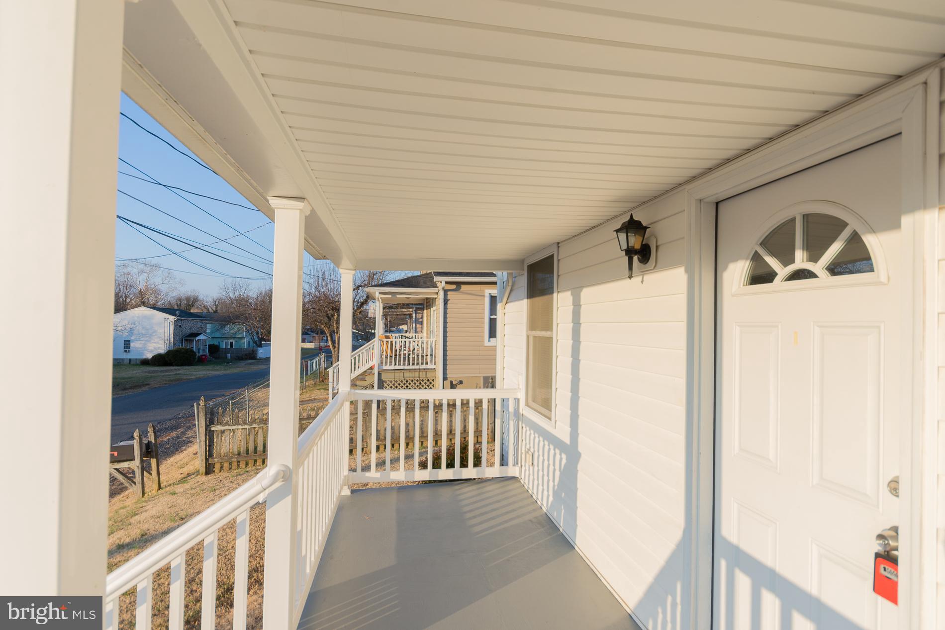 300 West 4th Avenue Ranson, WV 25438 - Photo 41 of 45 a view of a hallway with wooden floor and windows