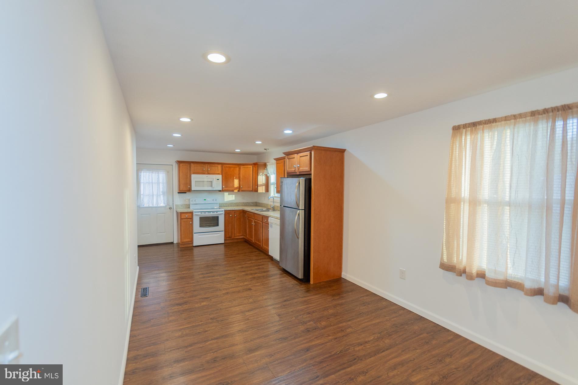 300 West 4th Avenue Ranson, WV 25438 - Photo 6 of 45 a view of kitchen with wooden floor