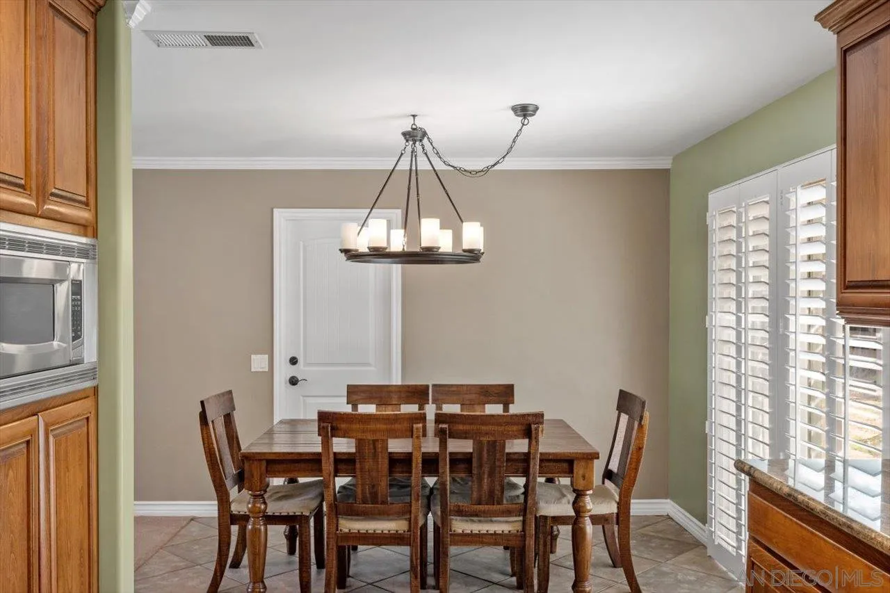 830 Steffy Road Ramona, CA 92065 - Photo 19 of 45 a view of a dining room with furniture window and outside view