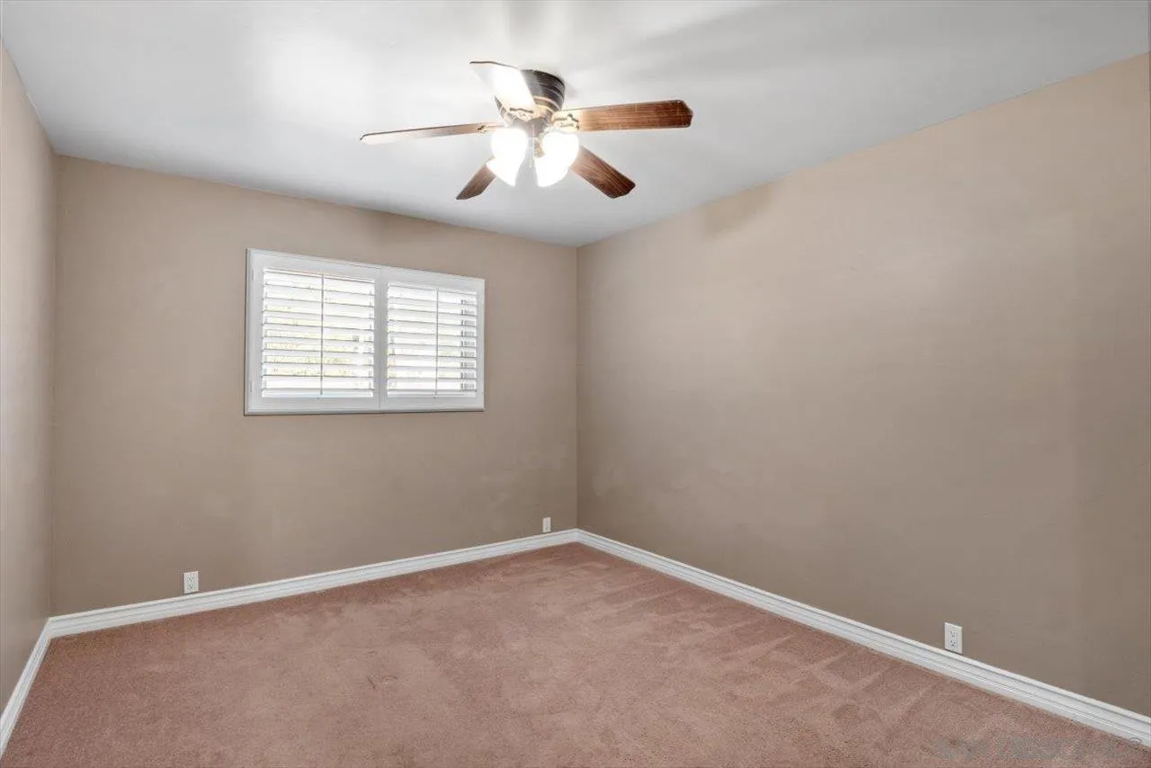 830 Steffy Road Ramona, CA 92065 - Photo 29 of 45 an empty room with windows and fan