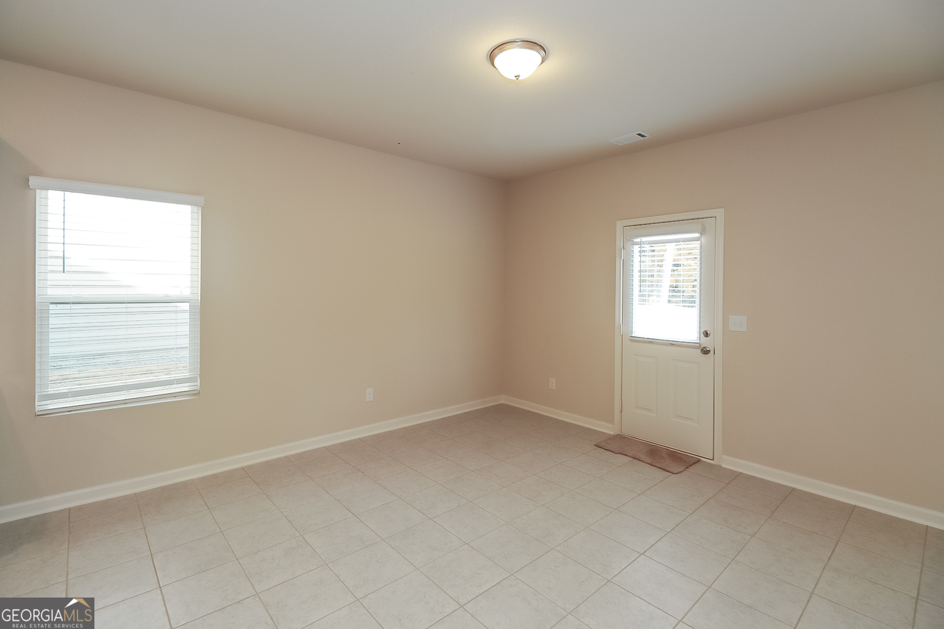 10910 Wheeler Trace Hampton, GA 30228 - Photo 12 of 17 an empty room with windows