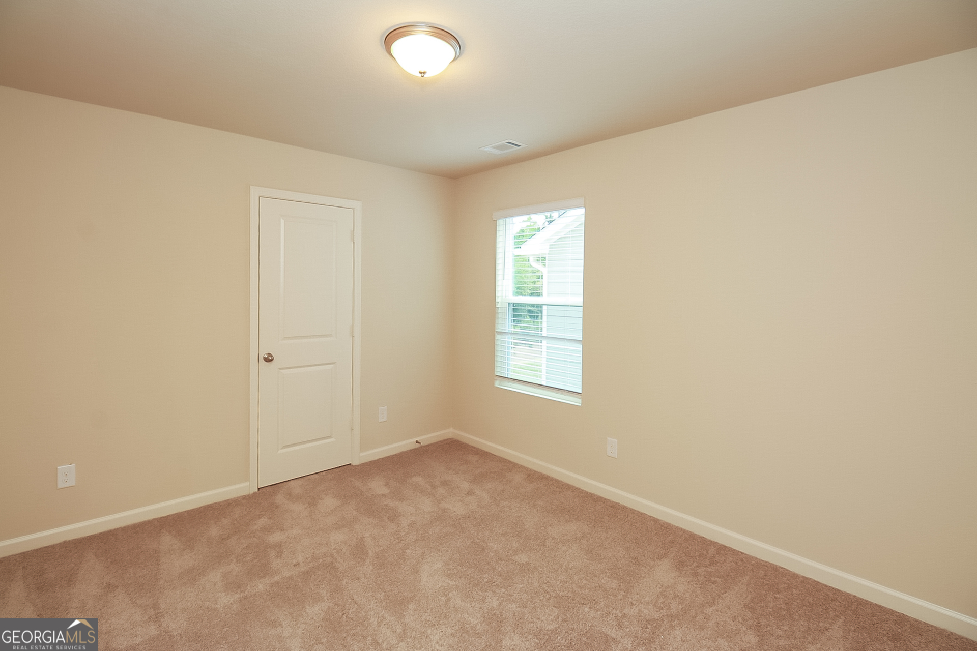 10910 Wheeler Trace Hampton, GA 30228 - Photo 13 of 17 an empty room with a window