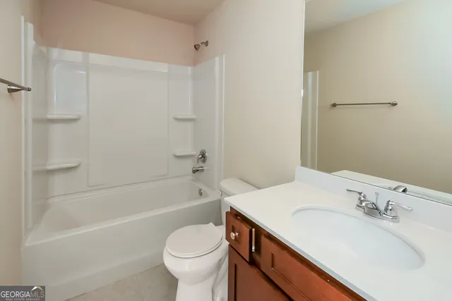 a bathroom with a sink a toilet and a bathtub