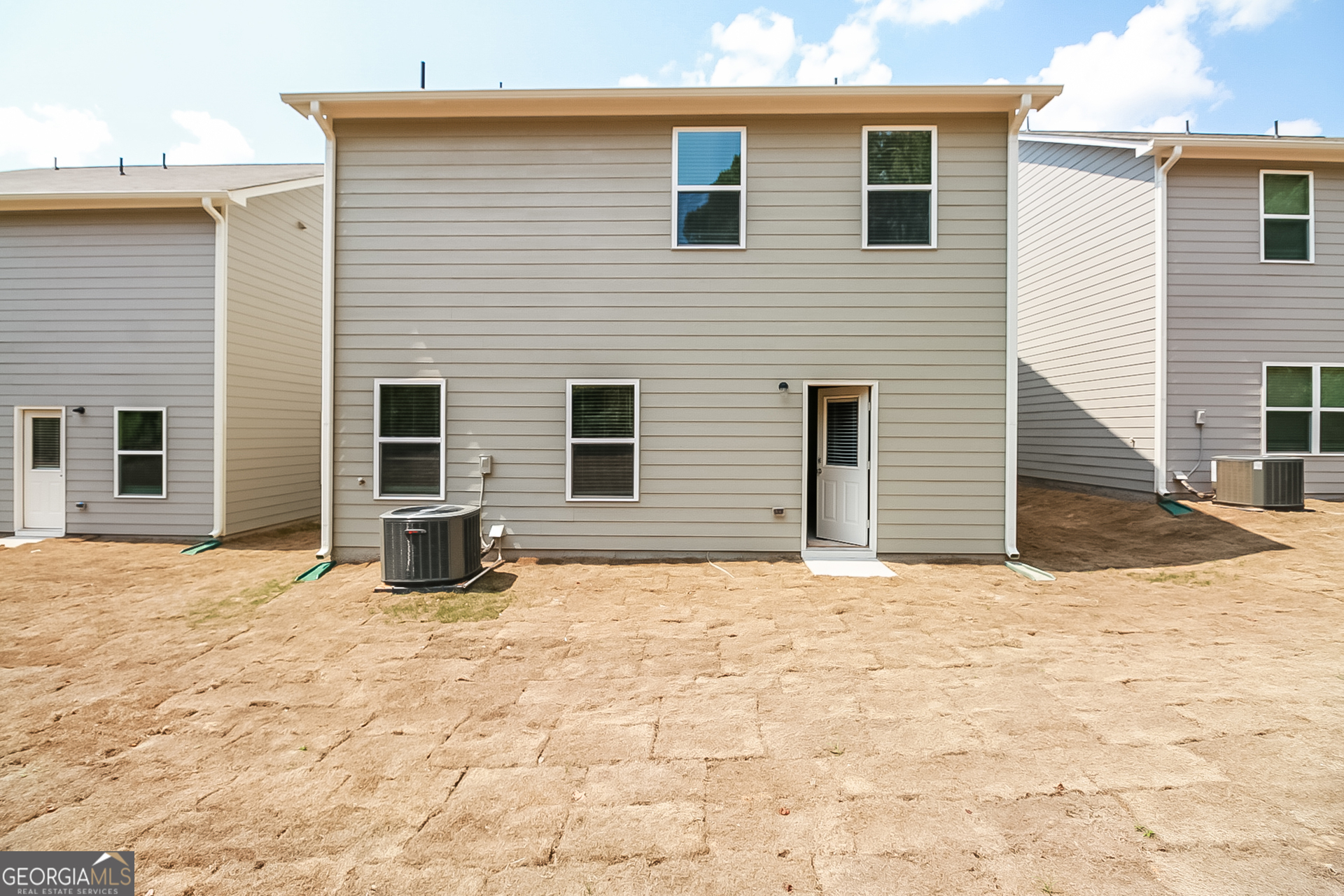 10910 Wheeler Trace Hampton, GA 30228 - Photo 15 of 17 a view of a house with a yard