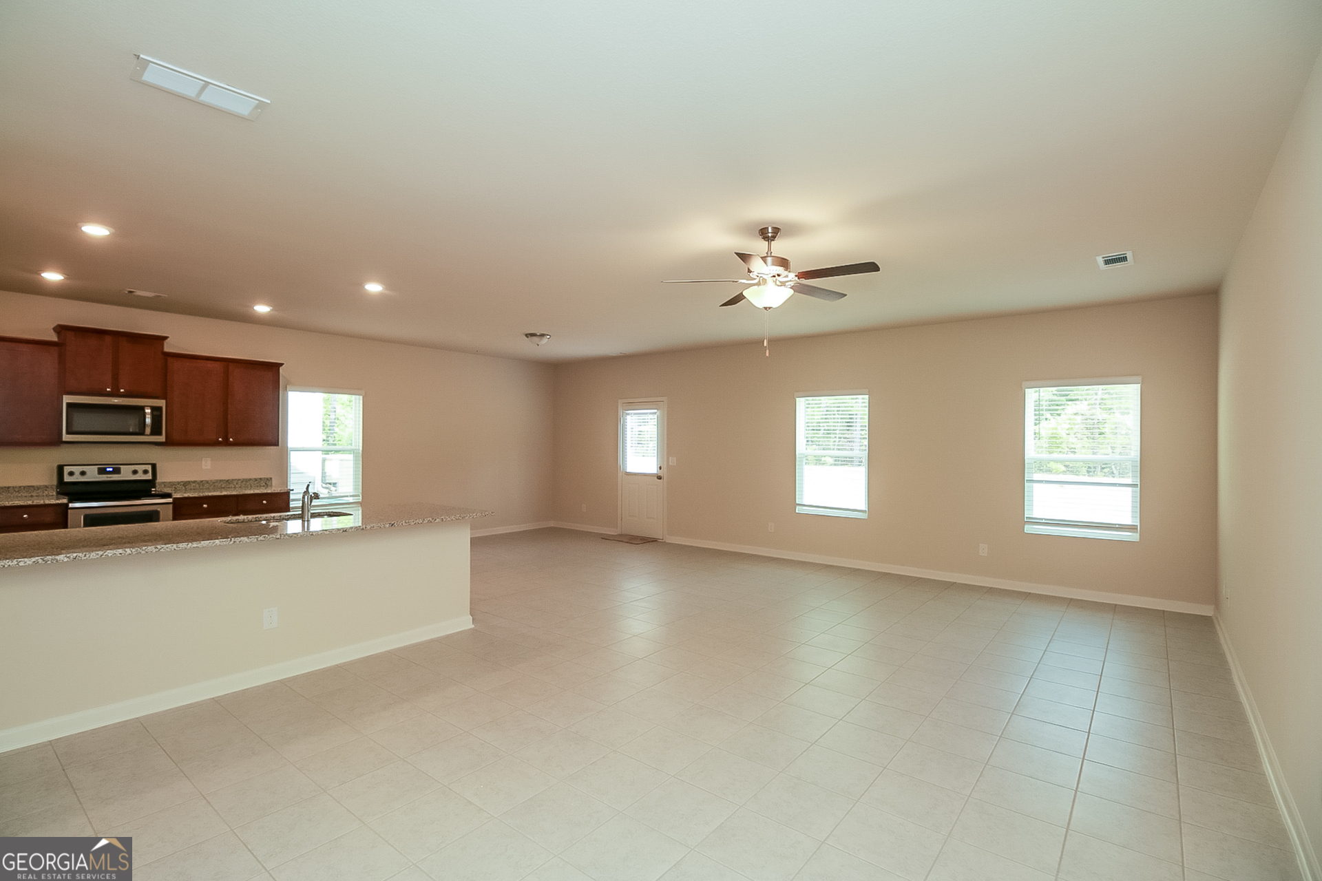 10910 Wheeler Trace Hampton, GA 30228 - Photo 2 of 17 a view of a livingroom with a kitchen