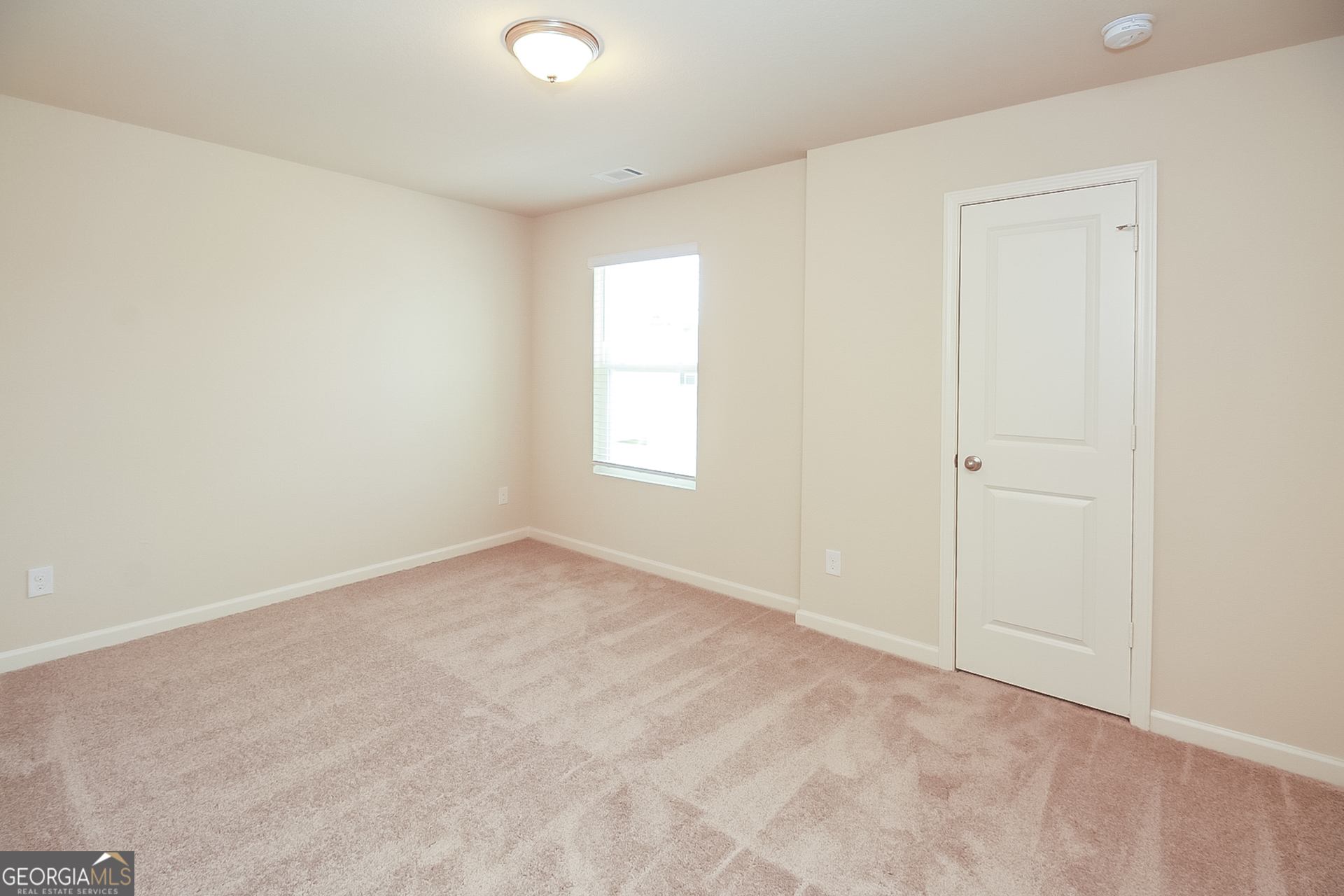 10910 Wheeler Trace Hampton, GA 30228 - Photo 10 of 17 an empty room with windows and closet