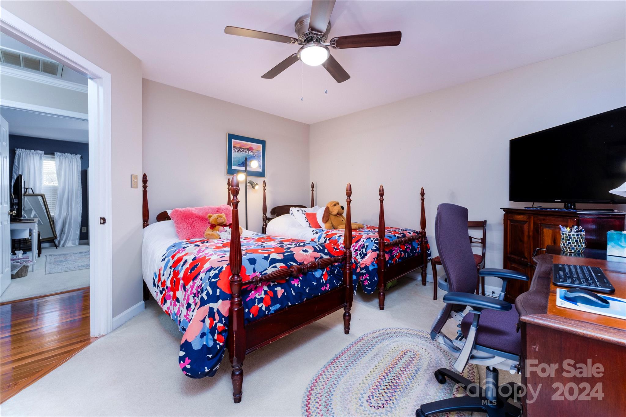 10744 Fairway Ridge Road Charlotte, NC 28277 - Photo 14 of 18 a bed room with furniture and a flat screen tv