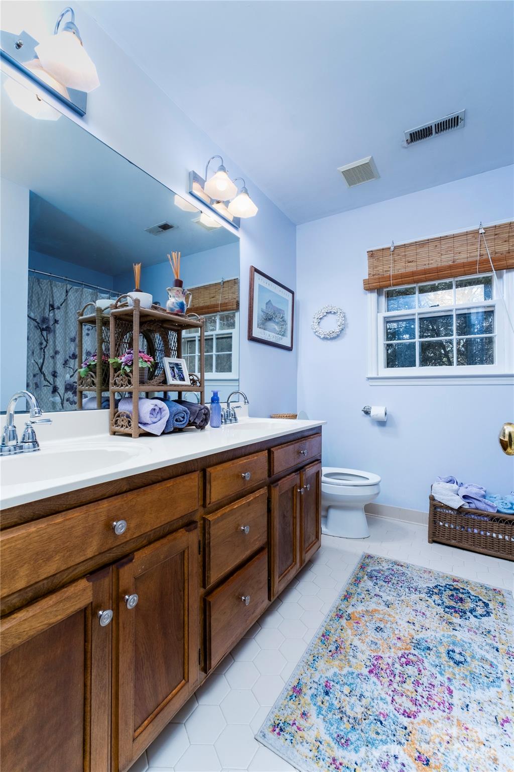 10744 Fairway Ridge Road Charlotte, NC 28277 - Photo 15 of 18 a spacious bathroom with a double vanity sink a mirror a bathtub and a shower