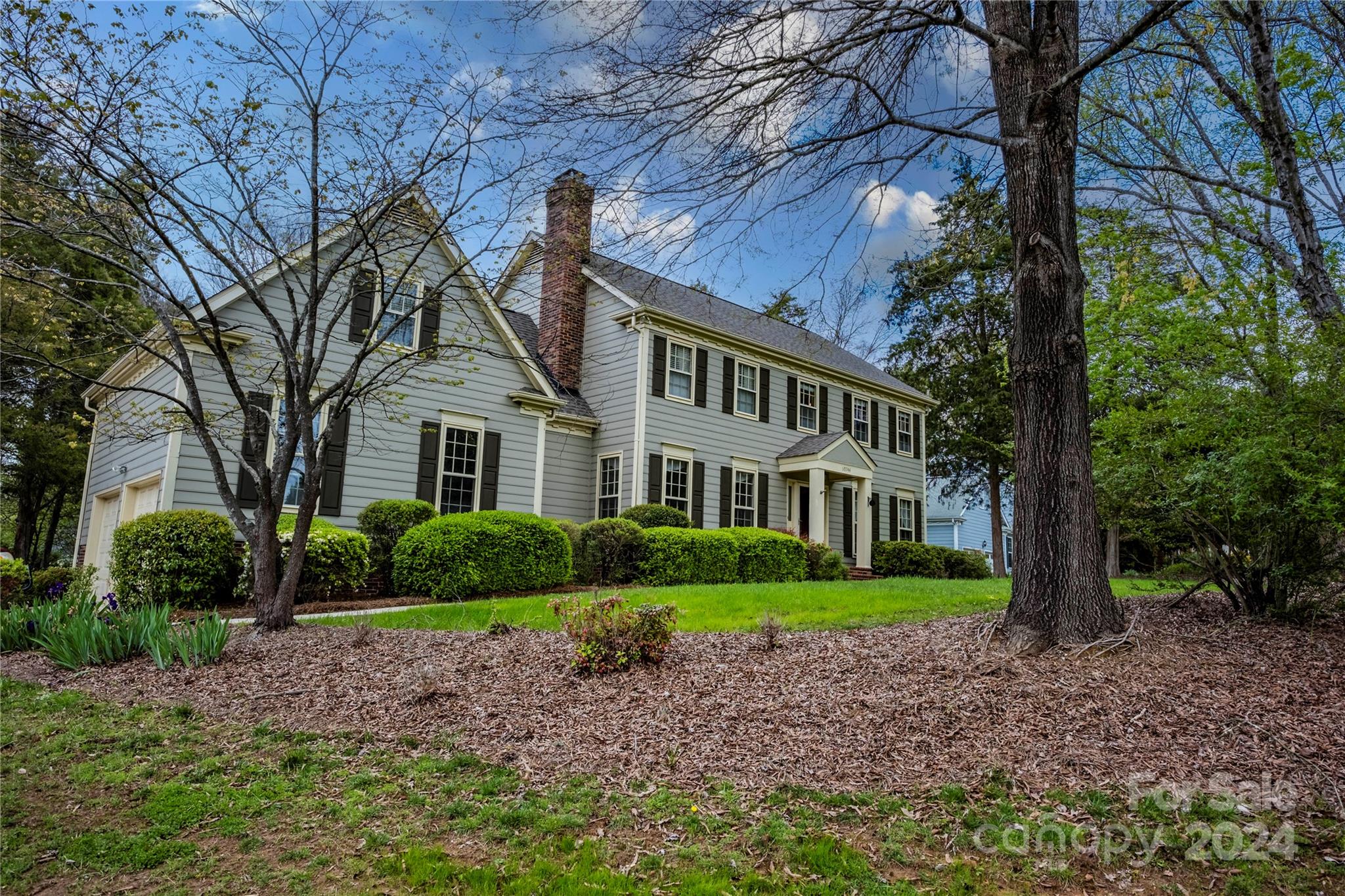 10744 Fairway Ridge Road Charlotte, NC 28277 - Photo 2 of 18 a front view of a house with garden