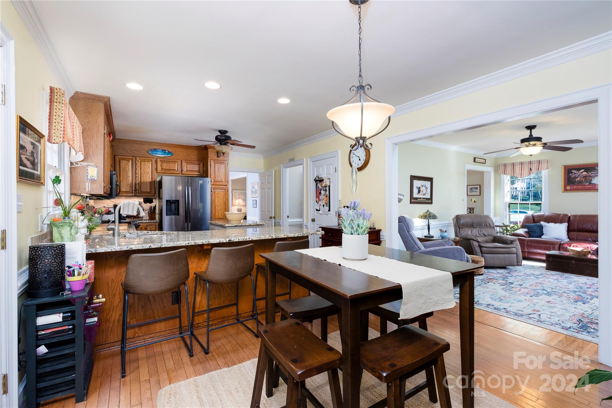 10744 Fairway Ridge Road Charlotte, NC 28277 - Photo 7 of 18 a dining table with chairs and window
