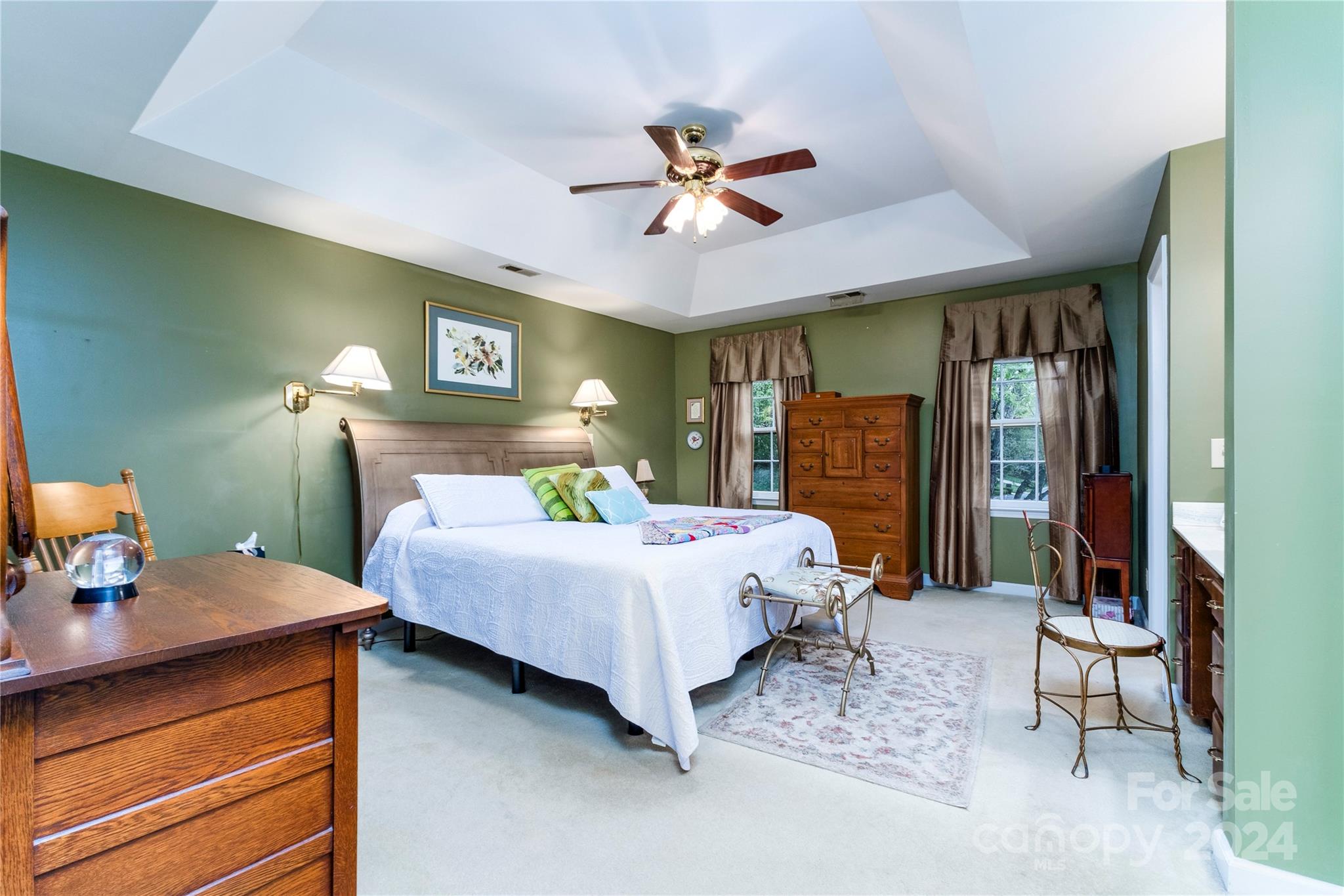 10744 Fairway Ridge Road Charlotte, NC 28277 - Photo 9 of 18 a bed room with a bed and a chandelier