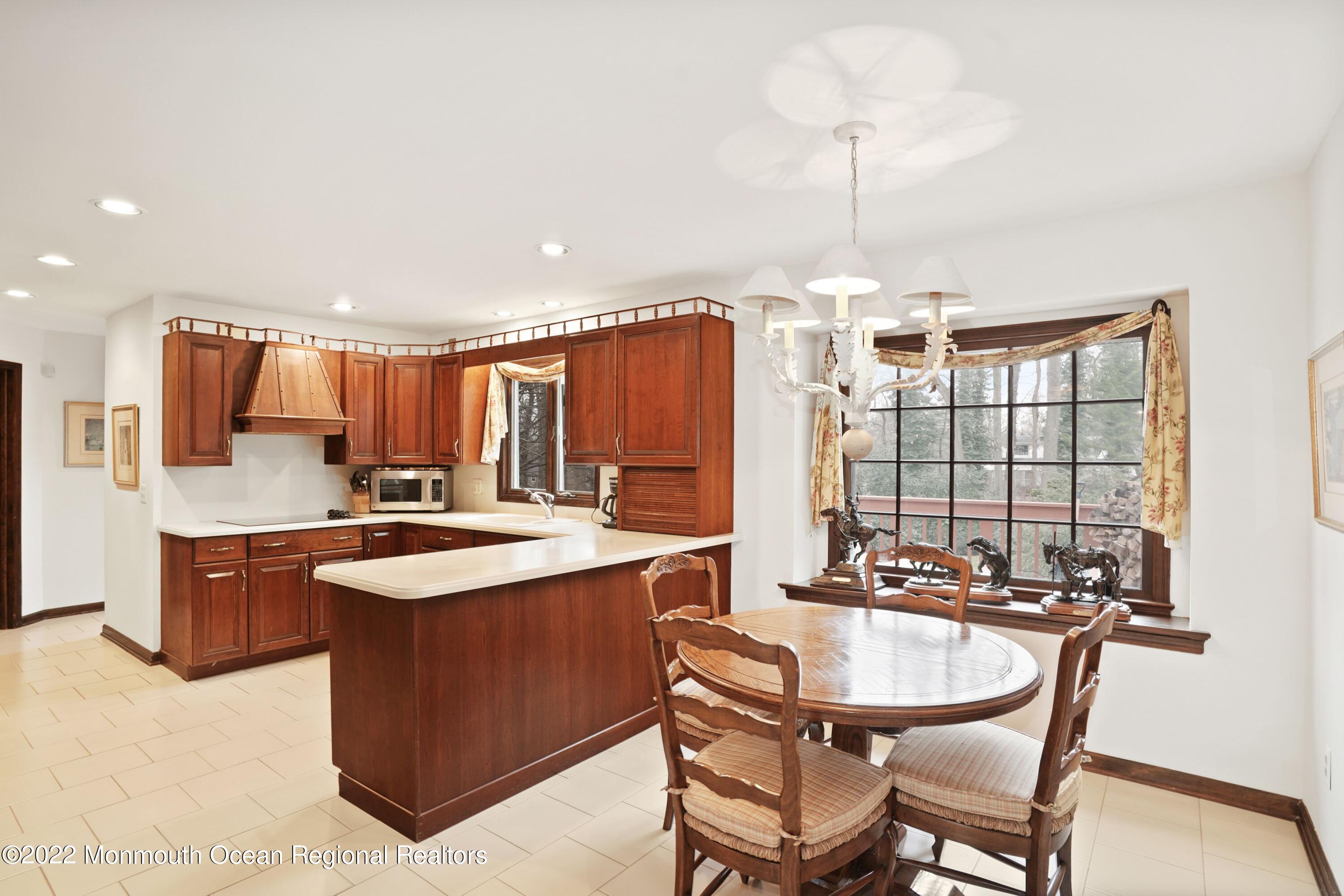 161 Hillyer Circle Middletown, NJ 07748 - Photo 21 of 64 a kitchen with a sink stove and cabinets