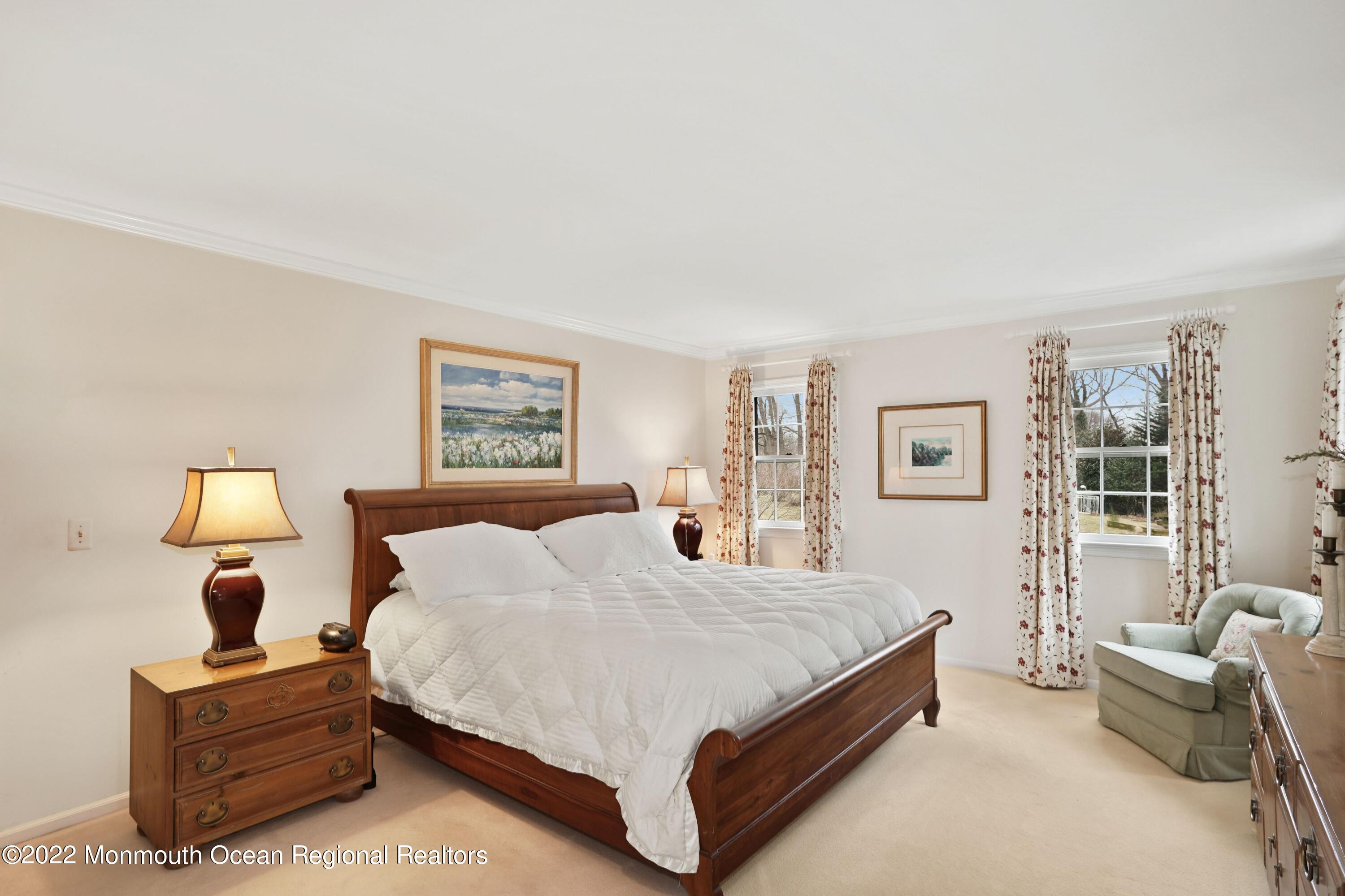 161 Hillyer Circle Middletown, NJ 07748 - Photo 44 of 64 a spacious bedroom with a bed and a couch