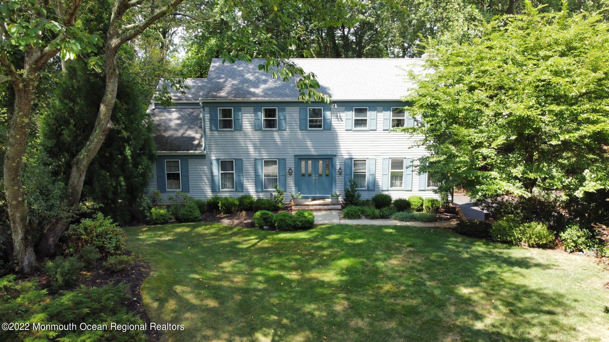 161 Hillyer Circle Middletown, NJ 07748 - Photo 6 of 64 a front view of a house with a yard and trees