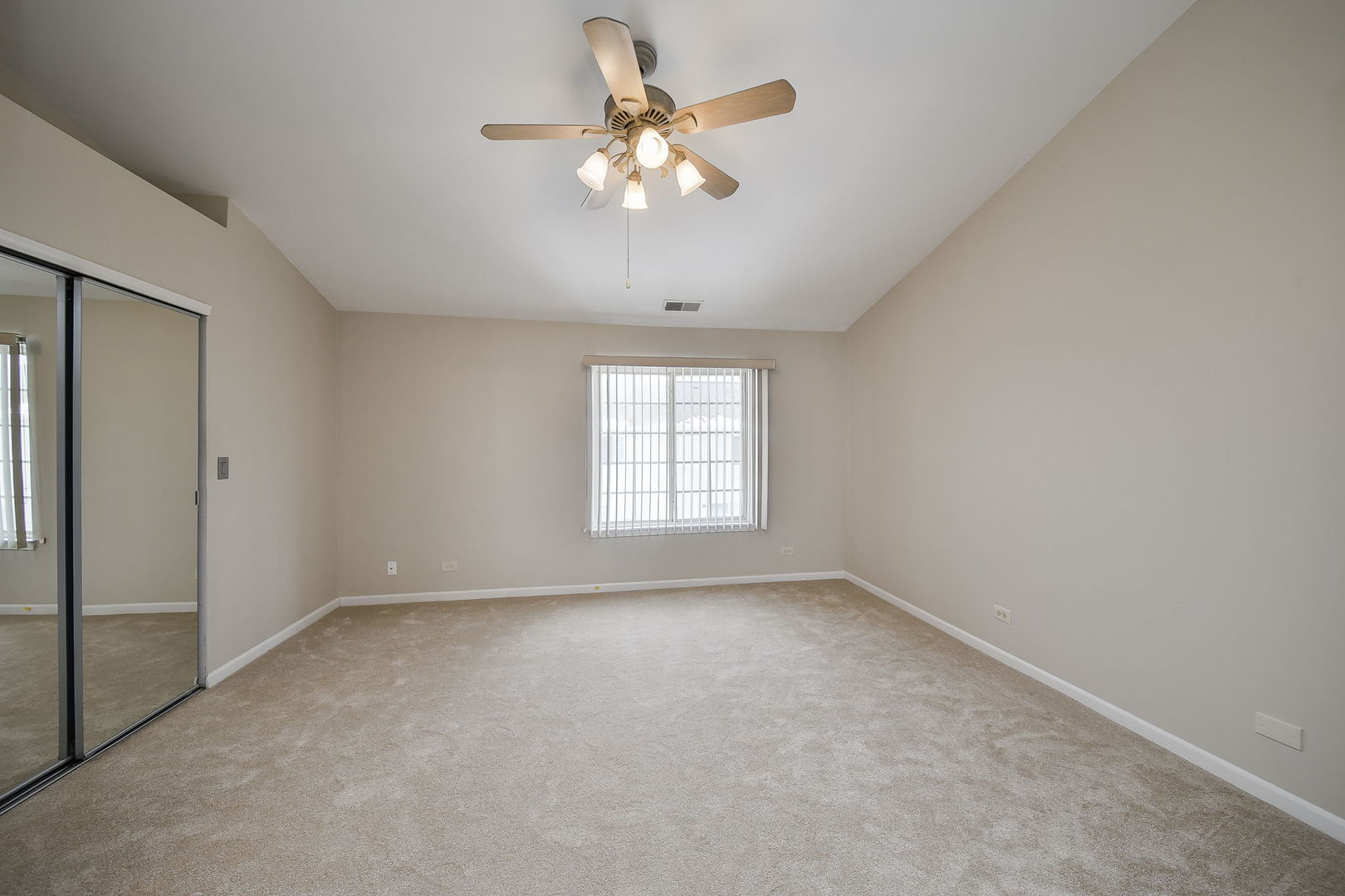 3447 Ravinia Circle Aurora, IL 60504 - Photo 13 of 14 a view of an empty room with a window