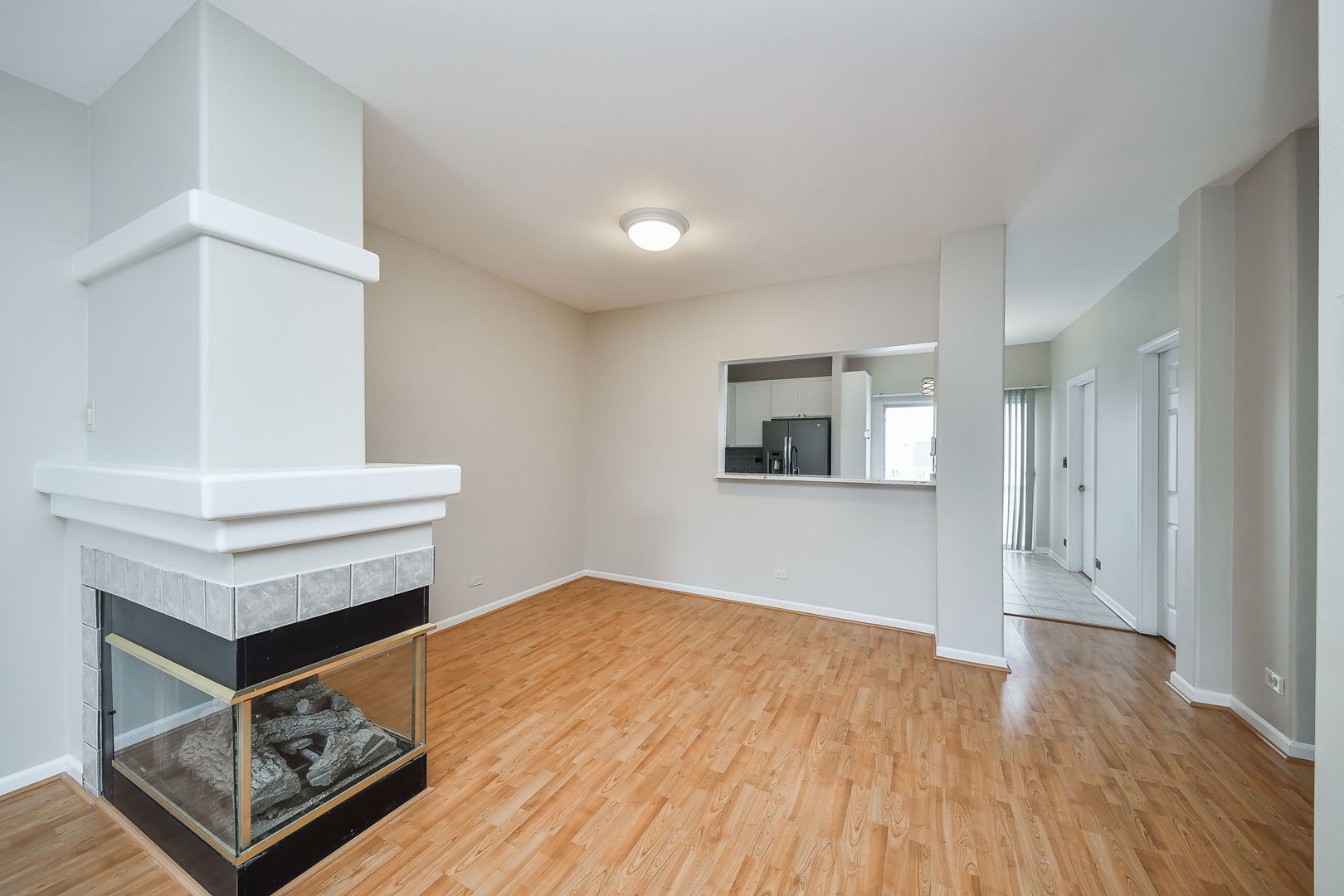 3447 Ravinia Circle Aurora, IL 60504 - Photo 4 of 14 a view of an empty room and wooden floor