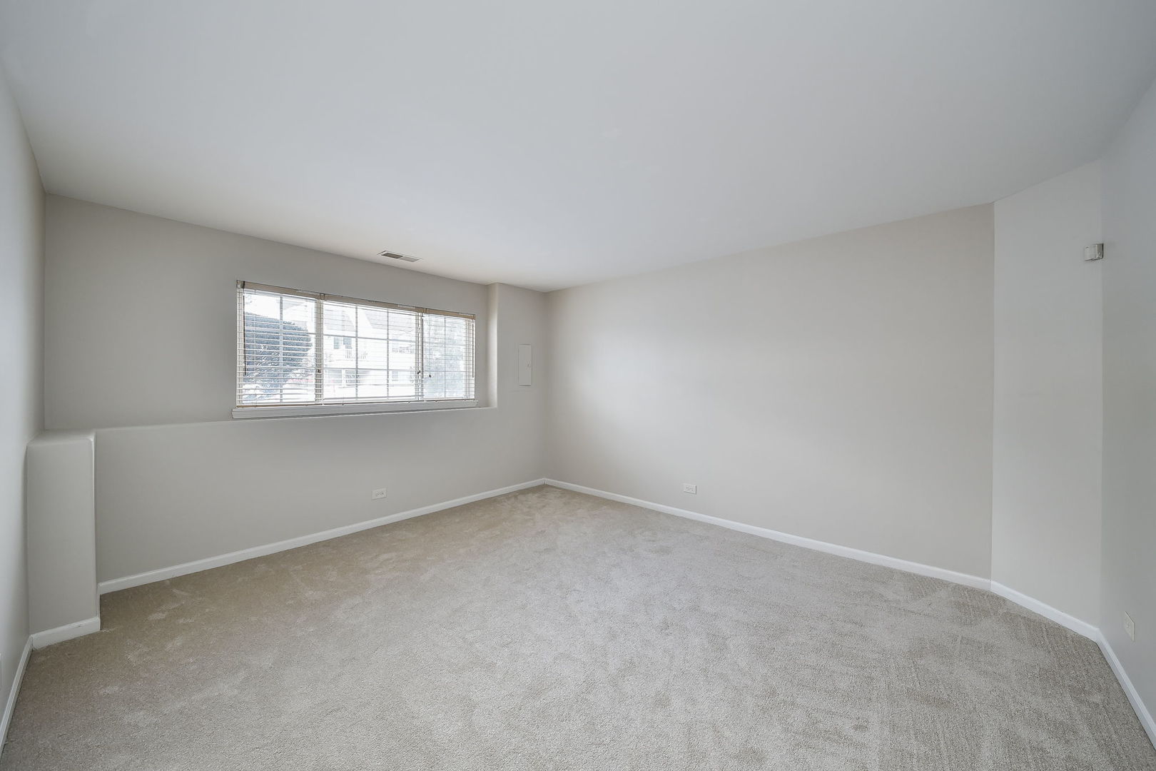 3447 Ravinia Circle Aurora, IL 60504 - Photo 10 of 14 a view of an empty room with a window
