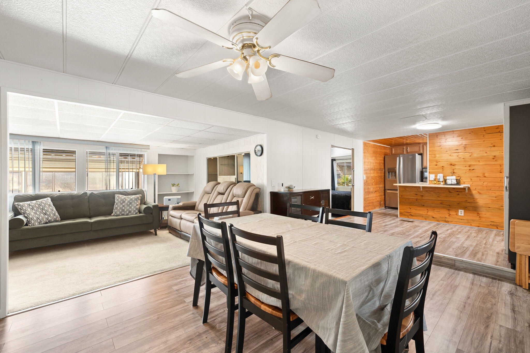 a view of a dining room with furniture window and wooden floor