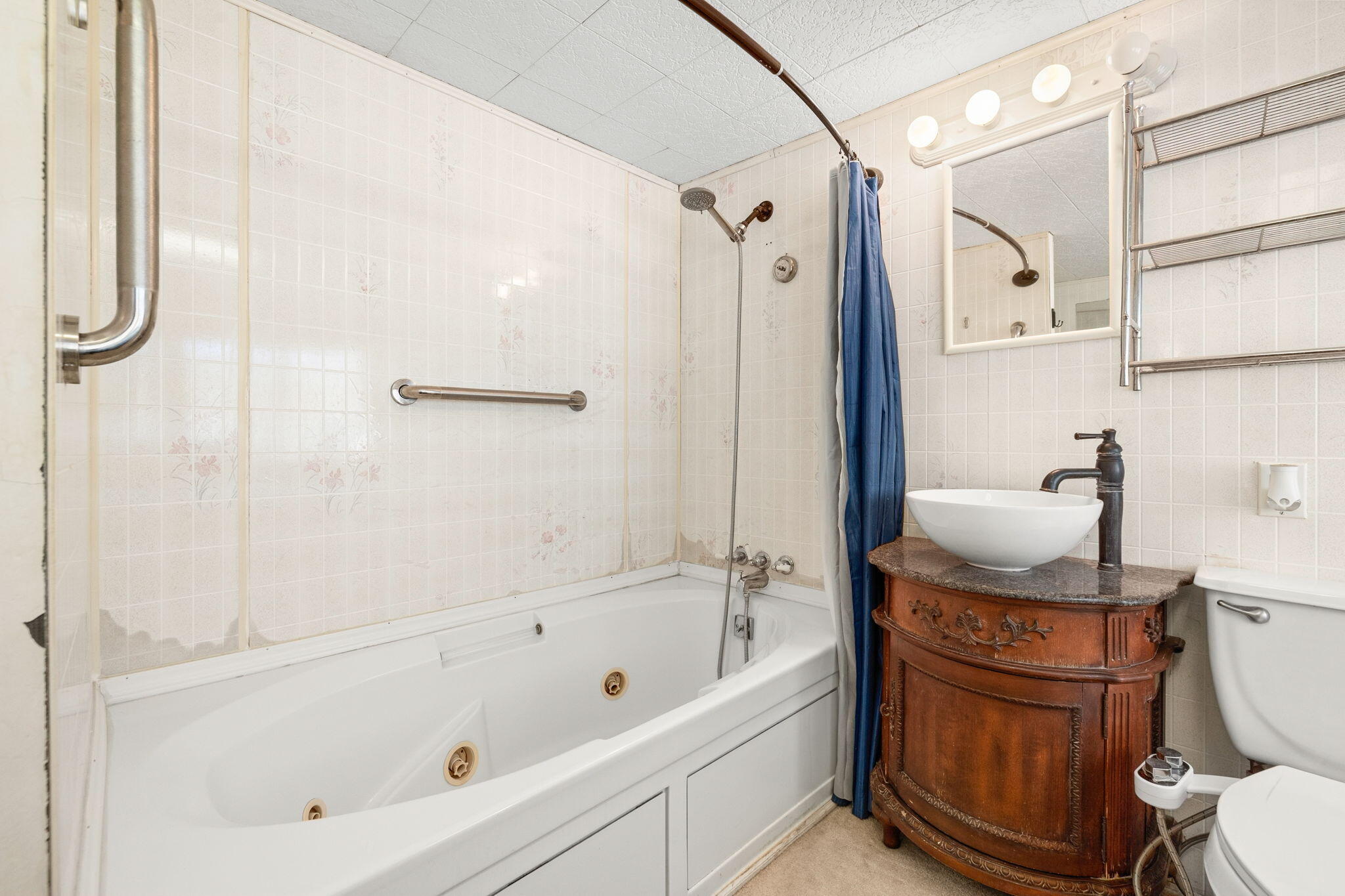 74711 Dillon Road, Unit 318 Desert Hot Springs, CA 92241 - Photo 29 of 53 a bathroom with a granite countertop bathtub shower sink vanity and toilet