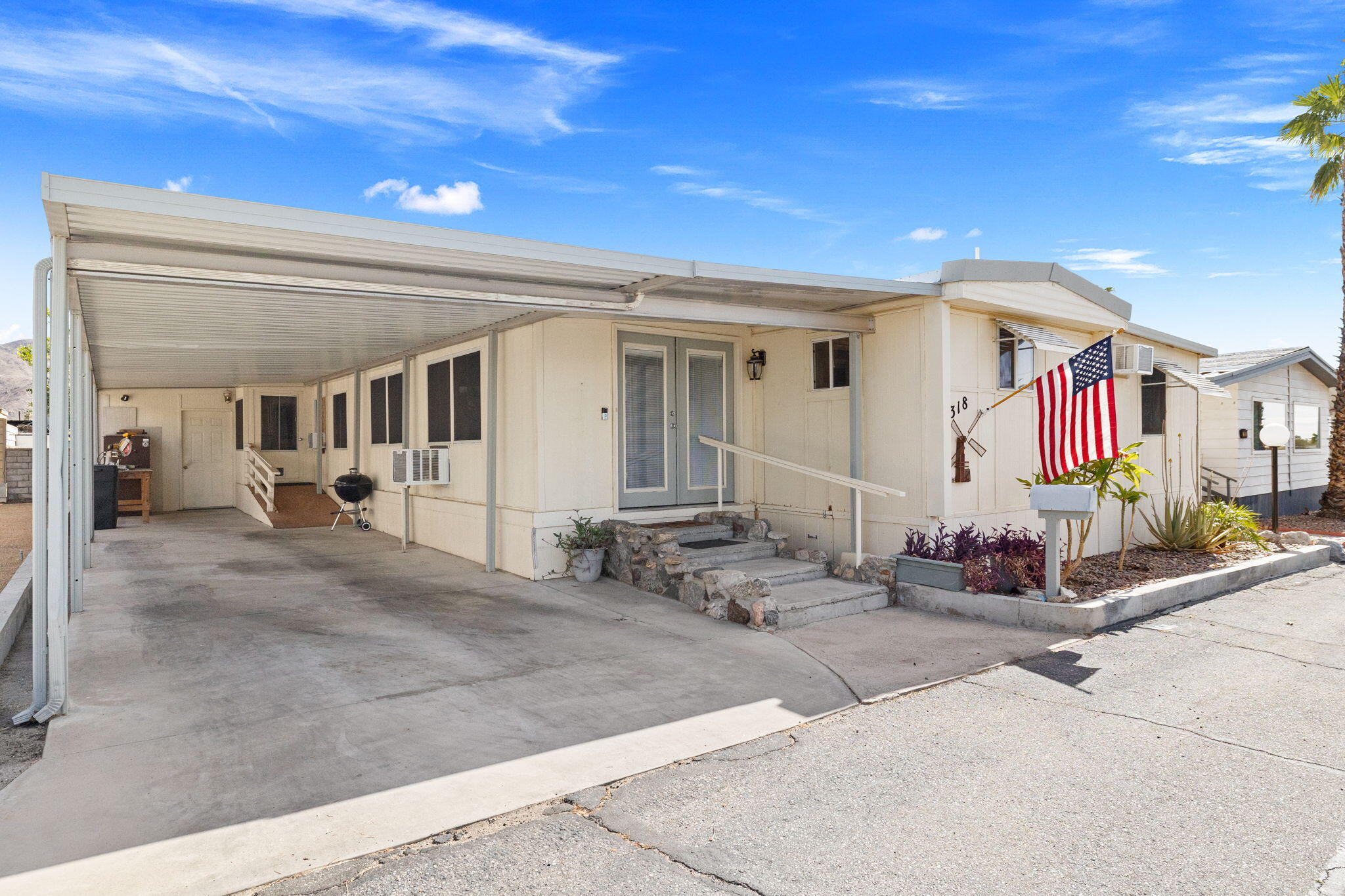 74711 Dillon Road, Unit 318 Desert Hot Springs, CA 92241 - Photo 3 of 53 a view of a house with porch