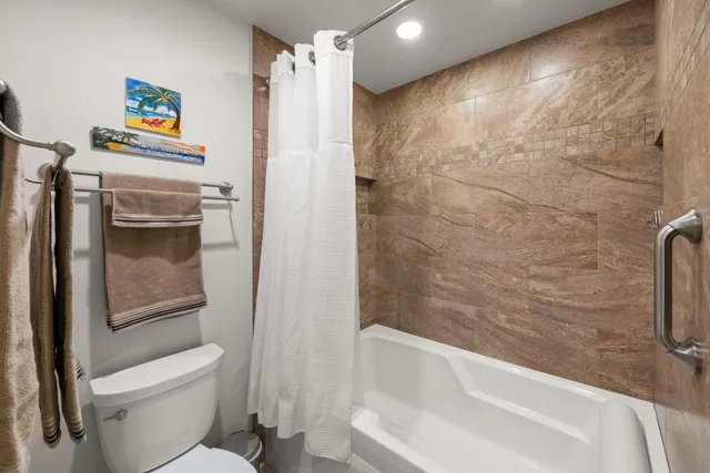 an aerial view of a house with a garden and trees