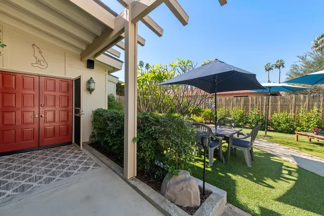 a kitchen with stainless steel appliances granite countertop a sink refrigerator and cabinets