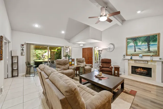 a view of a workspace with furniture and a kitchen