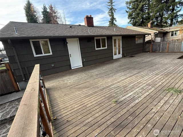 a backyard of a house with a yard and outdoor seating