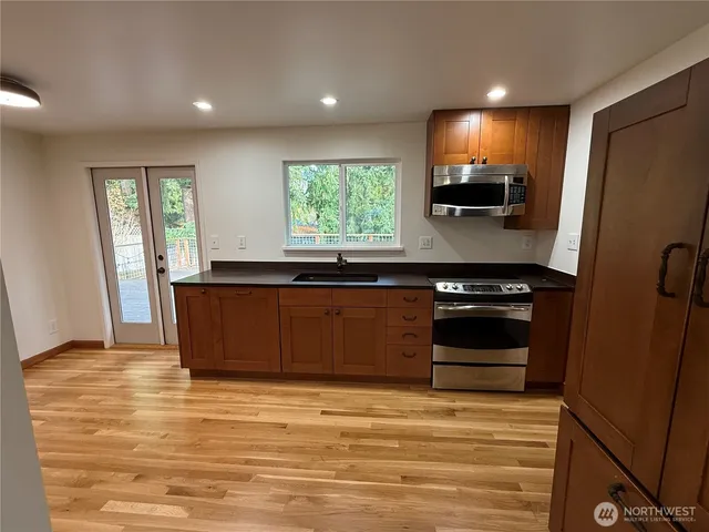 a view of a kitchen from the hallway