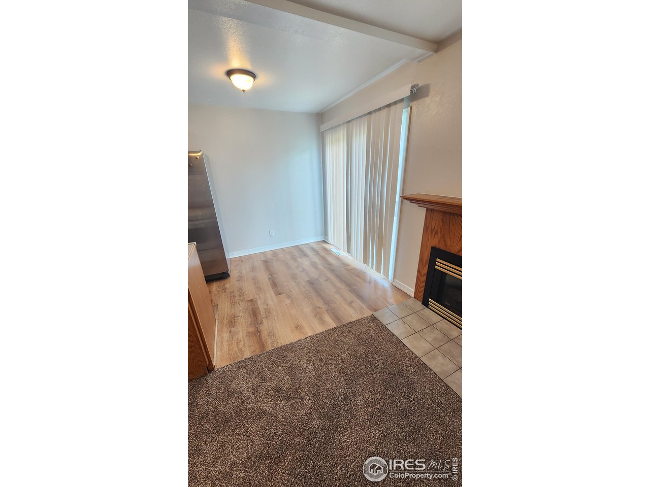 851 Denver Street, Unit 4 Sterling, CO 80751 - Photo 12 of 39 a bedroom with a bed and a mirror