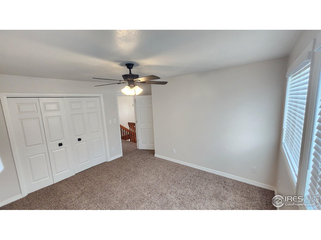 851 Denver Street, Unit 4 Sterling, CO 80751 - Photo 20 of 39 a open hall with a ceiling fan