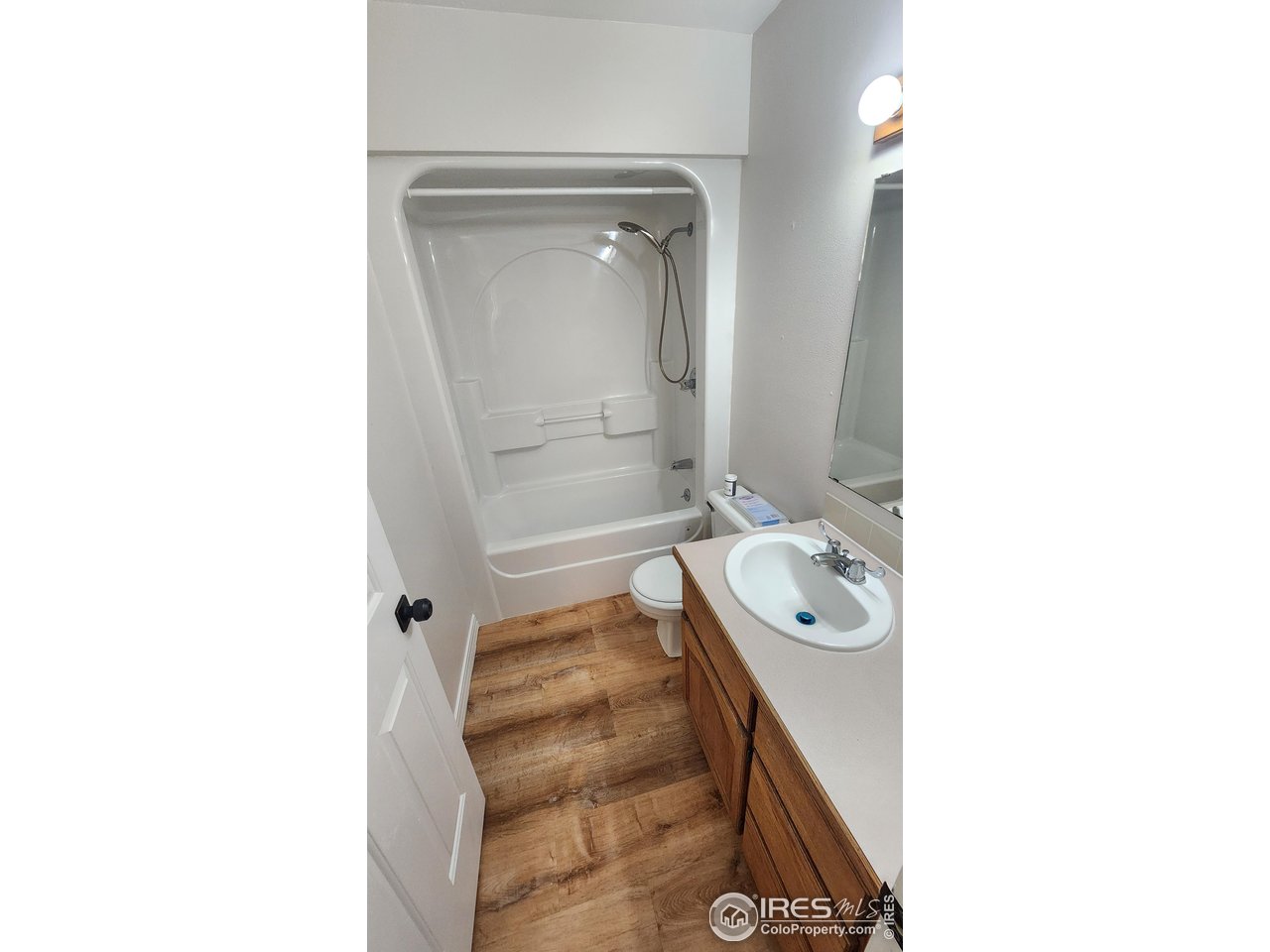 851 Denver Street, Unit 4 Sterling, CO 80751 - Photo 21 of 39 a bathroom with a sink a toilet and shower