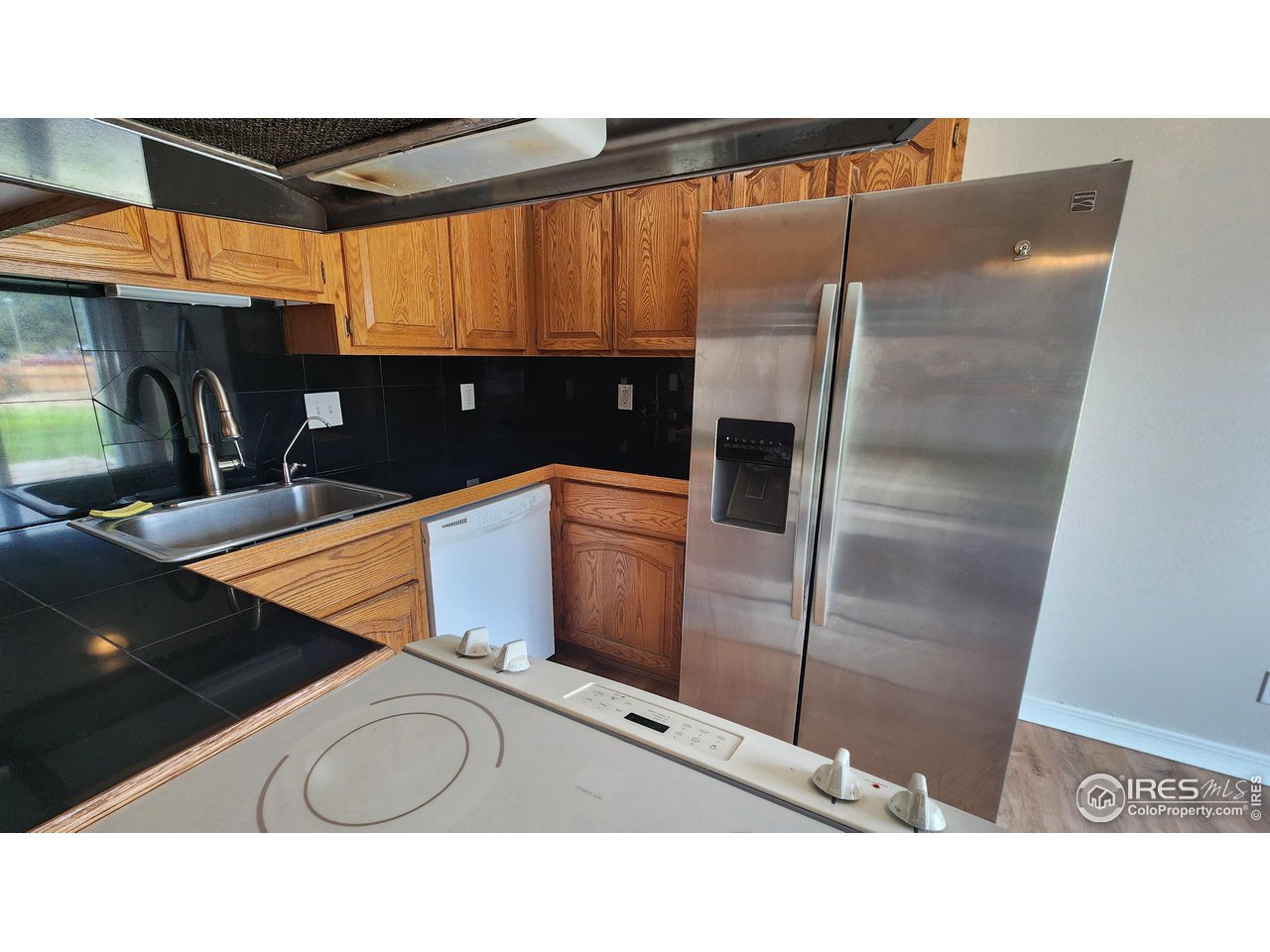 851 Denver Street, Unit 4 Sterling, CO 80751 - Photo 9 of 39 a bathroom with a sink and a mirror
