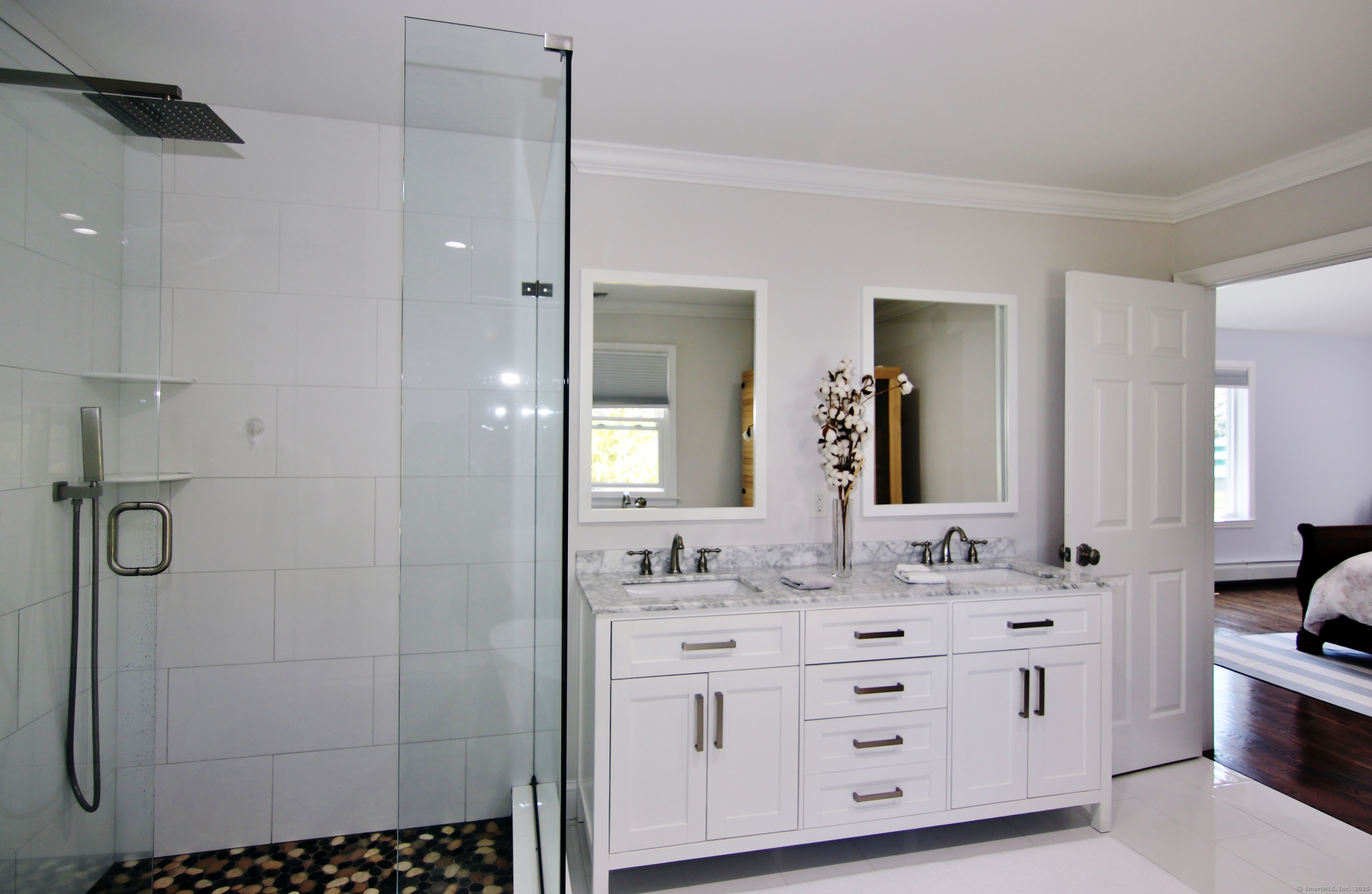 30 Possum Circle Norwalk, CT 06854 - Photo 17 of 23 a bathroom with a double vanity sink a toilet and shower