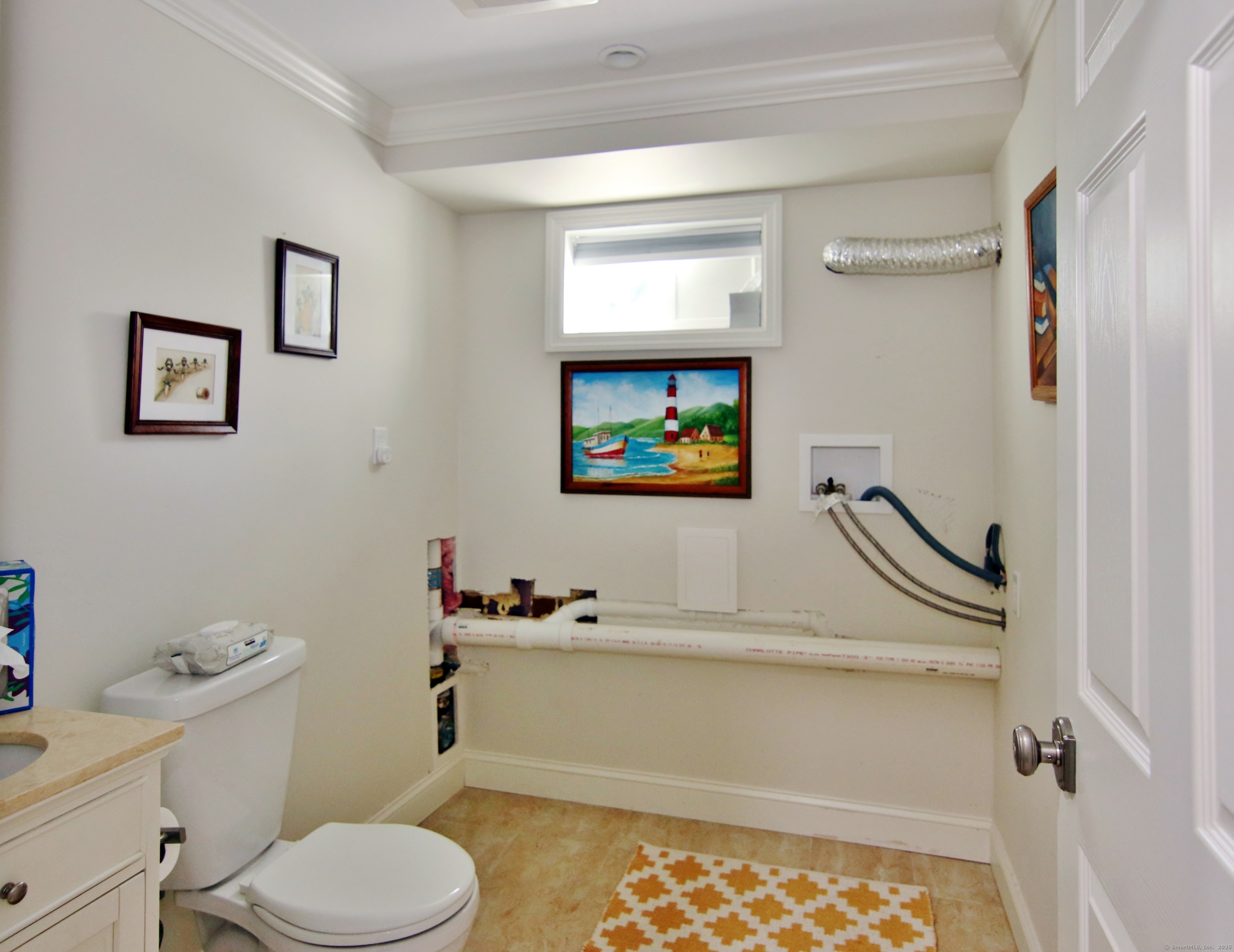 30 Possum Circle Norwalk, CT 06854 - Photo 22 of 23 a bathroom with a toilet sink and mirror