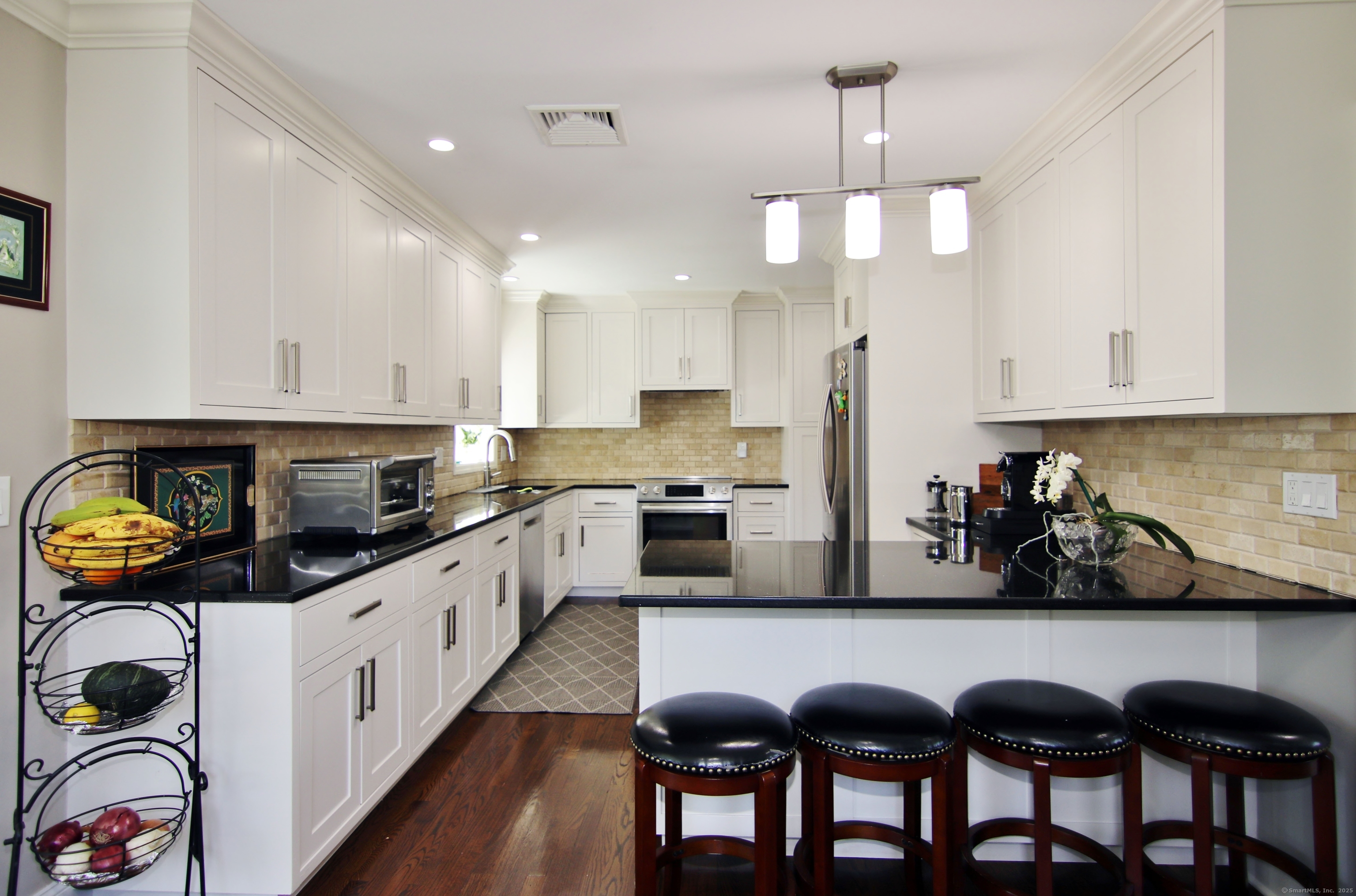 30 Possum Circle Norwalk, CT 06854 - Photo 5 of 23 a kitchen with granite countertop a sink stainless steel appliances and cabinets