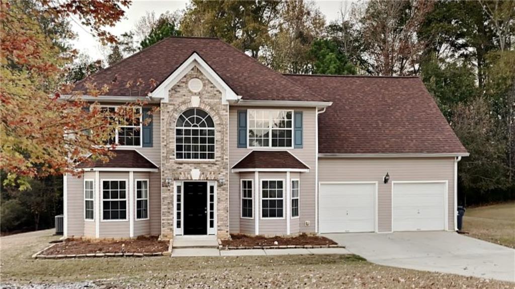 a front view of a house with a yard