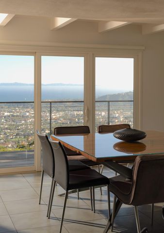 a view of a dining room with furniture and window